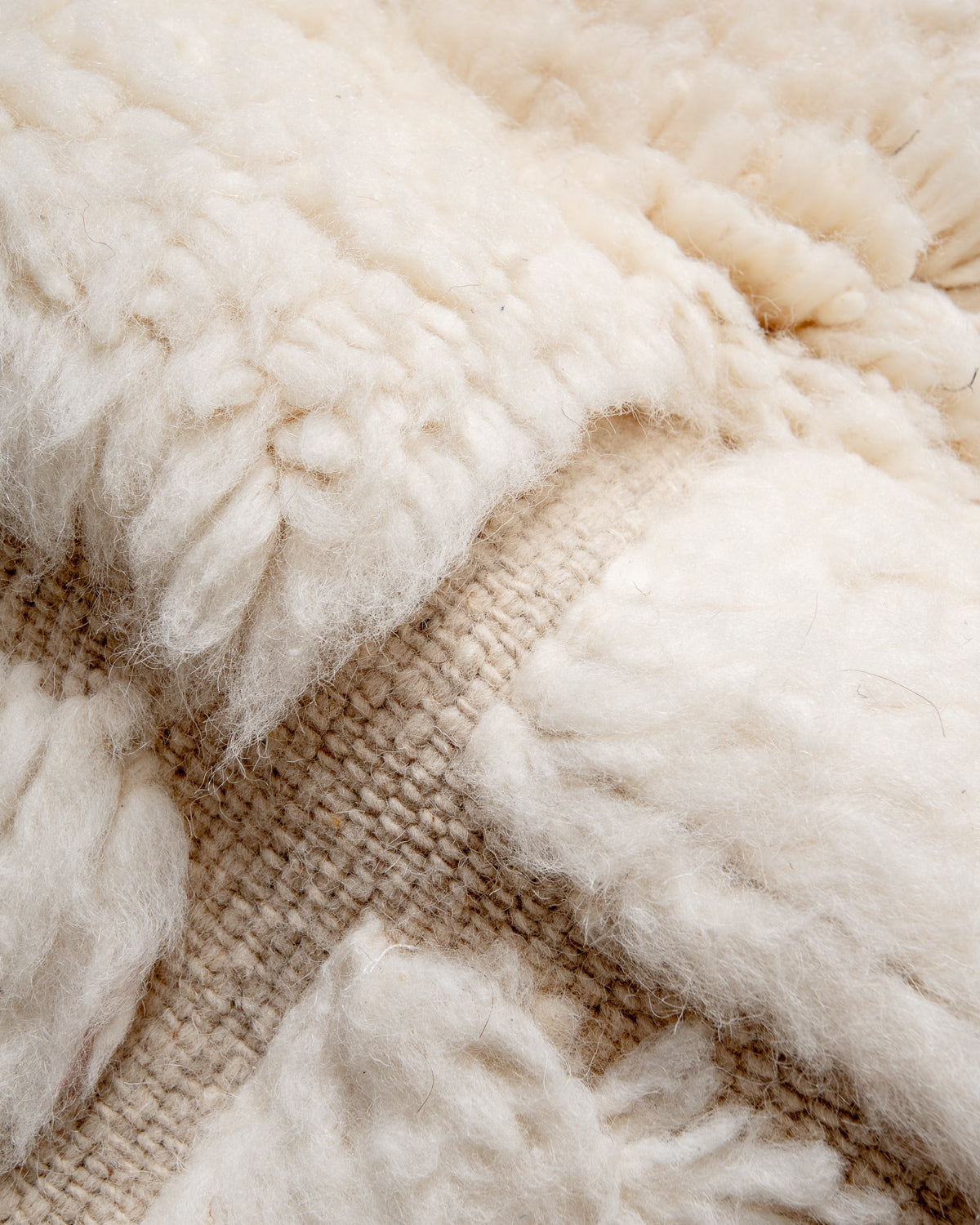Modern, designer, handcrafted Berber rug from Morocco. Beniourain carpet with minimalist design, natural wool pile and a fluffy texture.